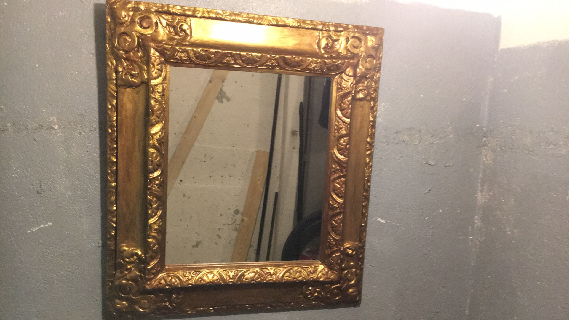 Mirror in gold frame