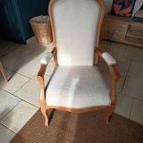 Renovated Voltaire armchair with boucle fabric.