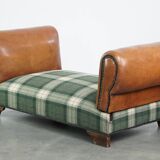 Antique daybed reupholstered with sheepskin and Scottish tartan wool