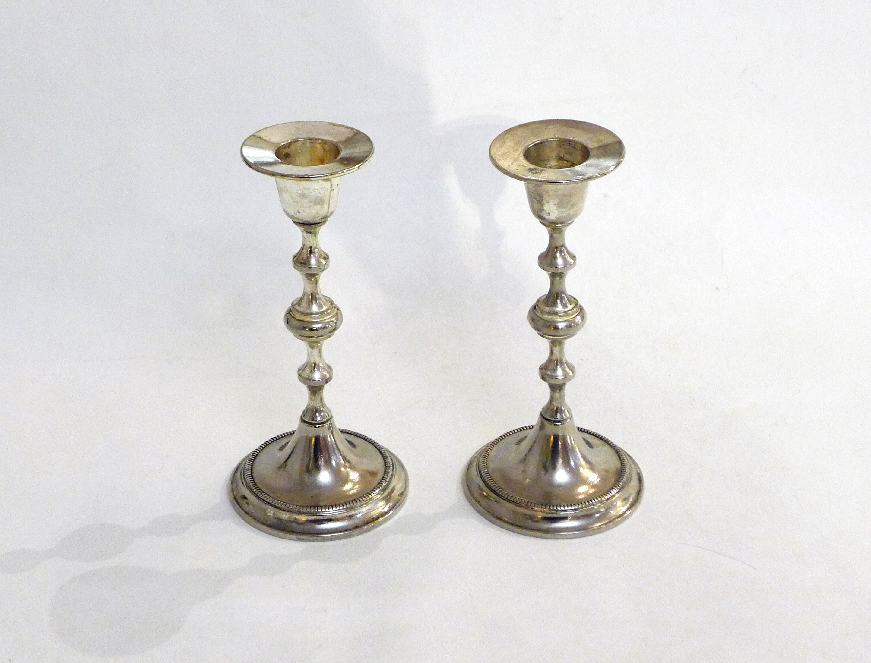 Pair of metal candle holders
