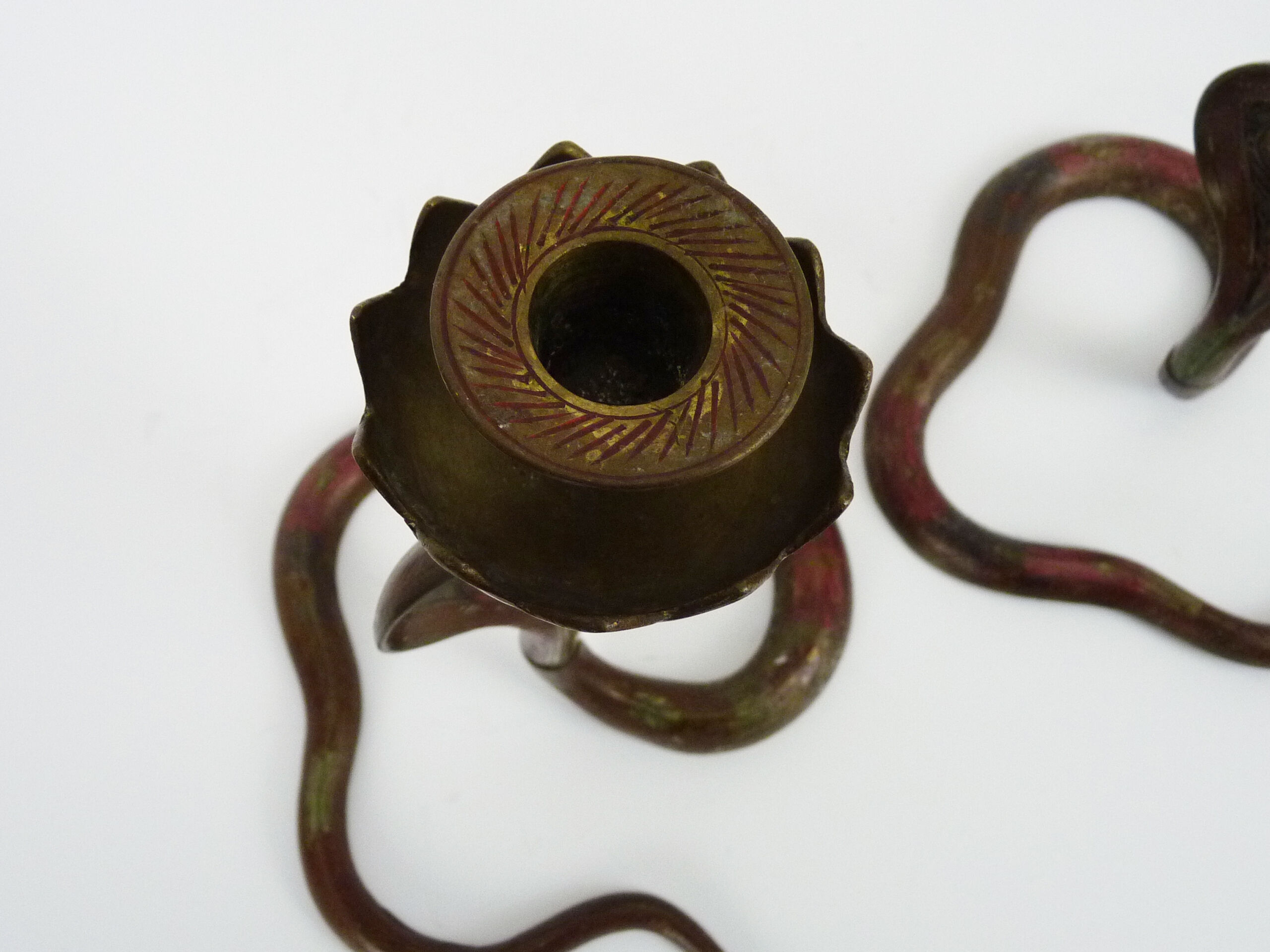 Pair of old bronze cobra candle holders with detailed engraving. Around 1950