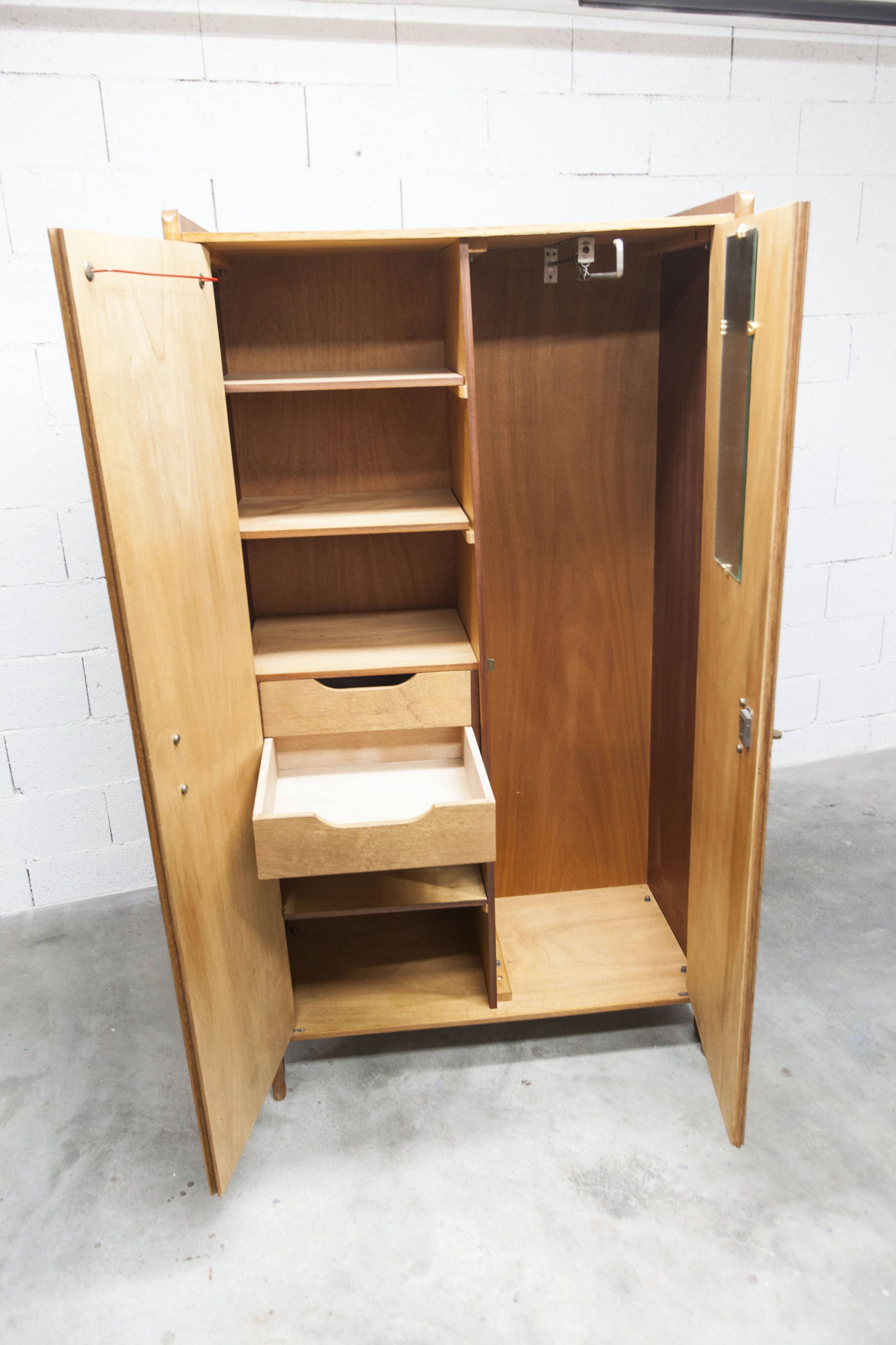 1950s Mid-Century Modern oak armoire with two doors and two drawers.