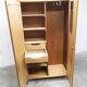 1950s Mid-Century Modern oak armoire with two doors and two drawers.