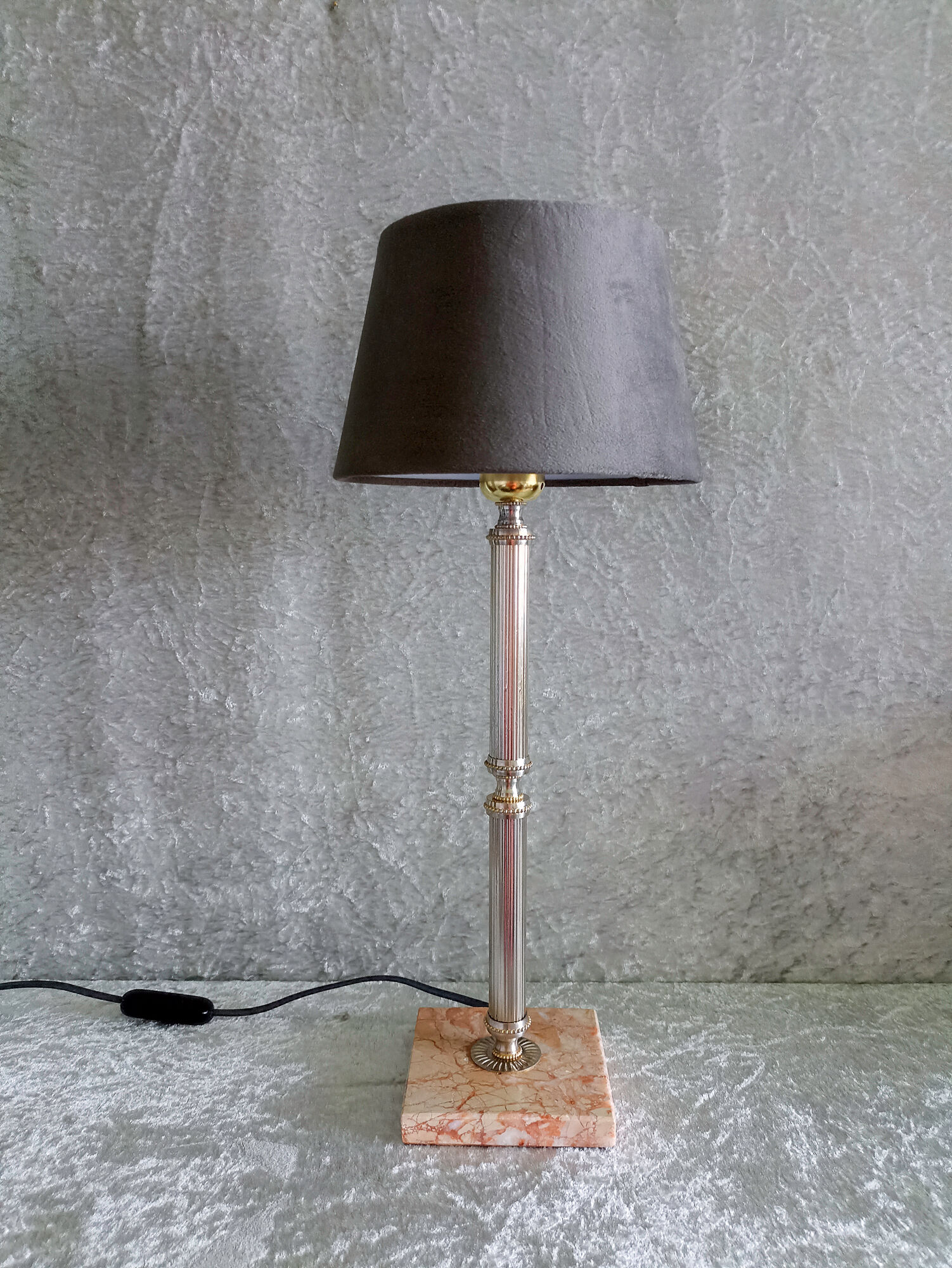 Golden metal lamp with pink marble base