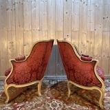 Pair of gondola armchairs in Louis XV style with highlighted wood.