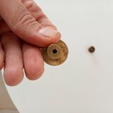 Pair of antique furniture knobs in gilded brass.