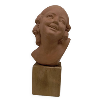 Bust young smiling girl. Circa 1900. Art Deco. Signed.