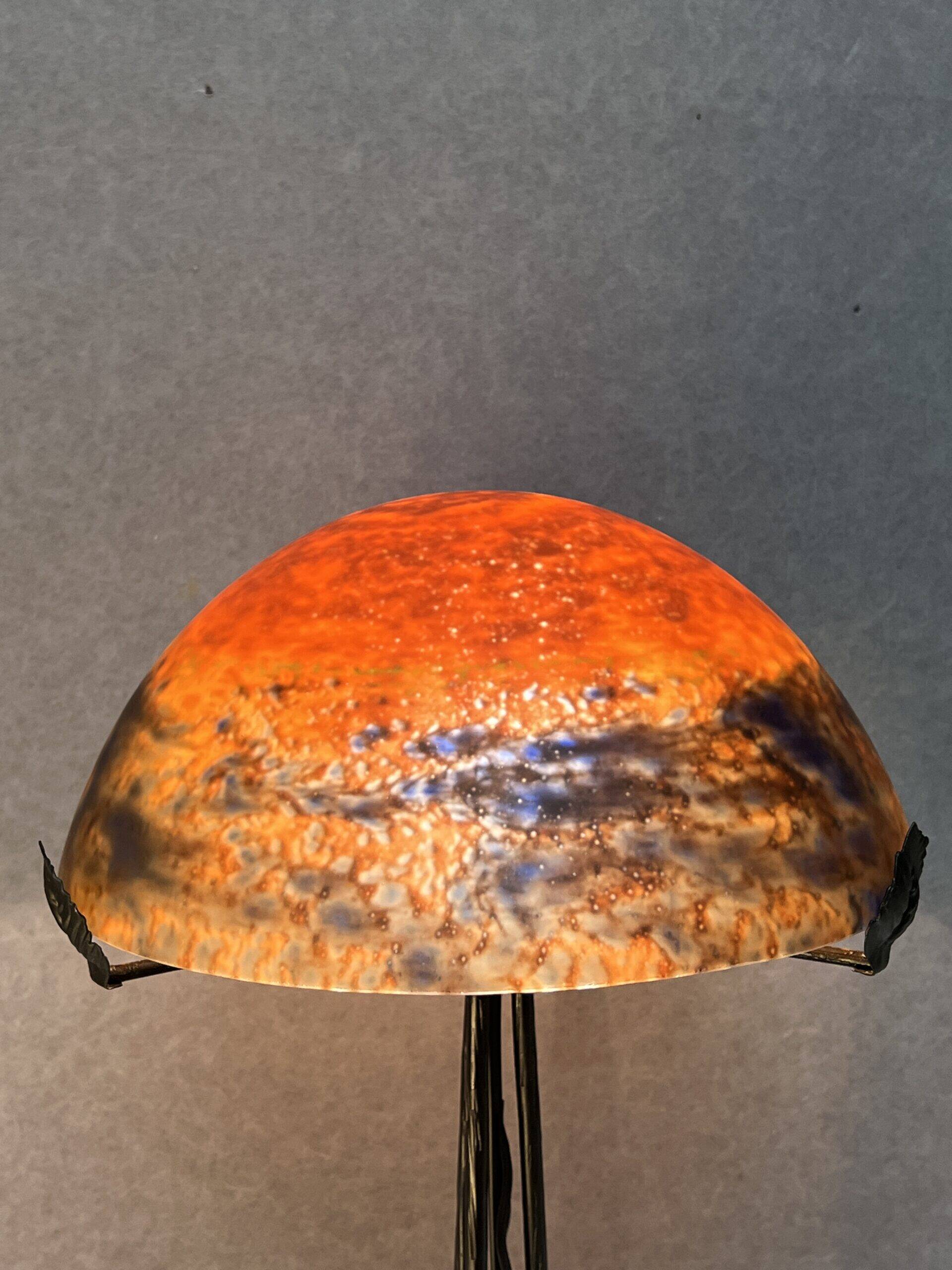 Contemporary mushroom lamp, wrought iron base and shaded orange glass shell