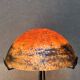 Contemporary mushroom lamp, wrought iron base and shaded orange glass shell