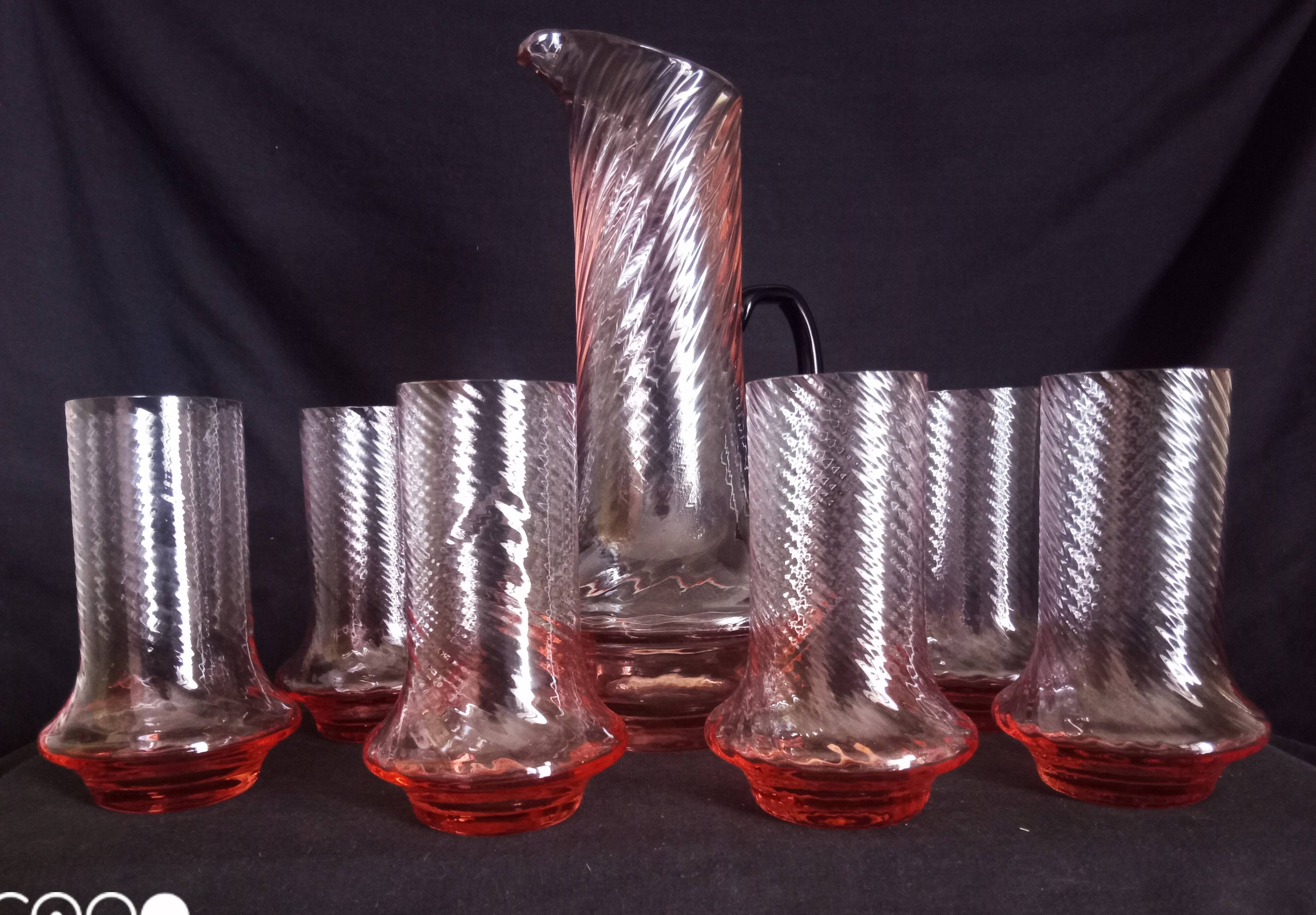 Art Deco orangeade service in pink-orange glass, twisted model.