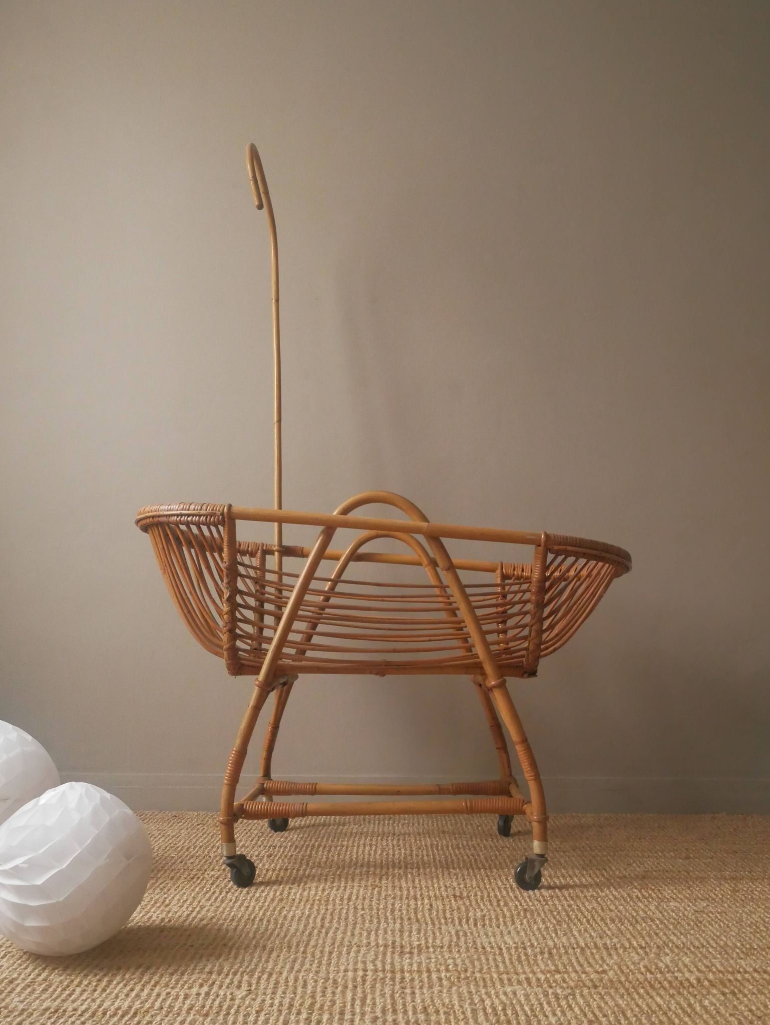 Vintage rattan cradle bassinet on wheels retro Scandinavian design baby bed