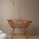 Vintage rattan cradle bassinet on wheels retro Scandinavian design baby bed
