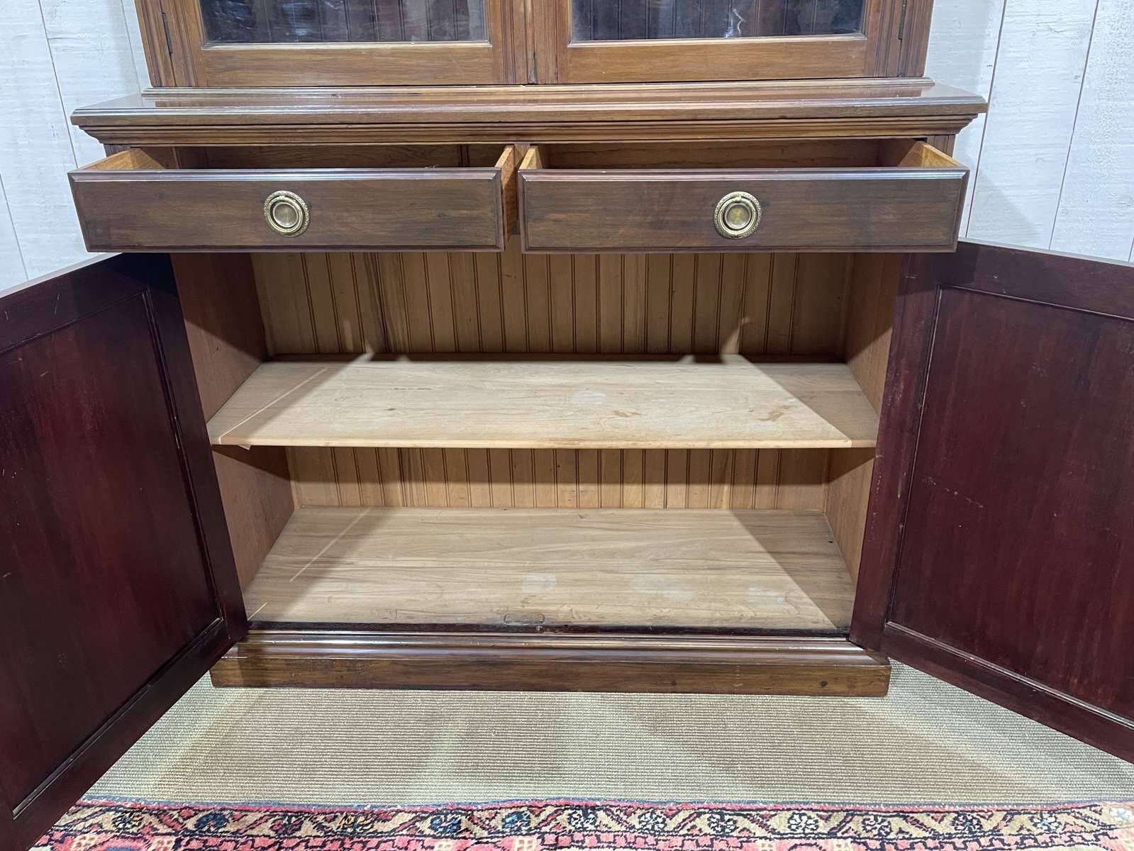 English walnut two-body library from the early 20th century.