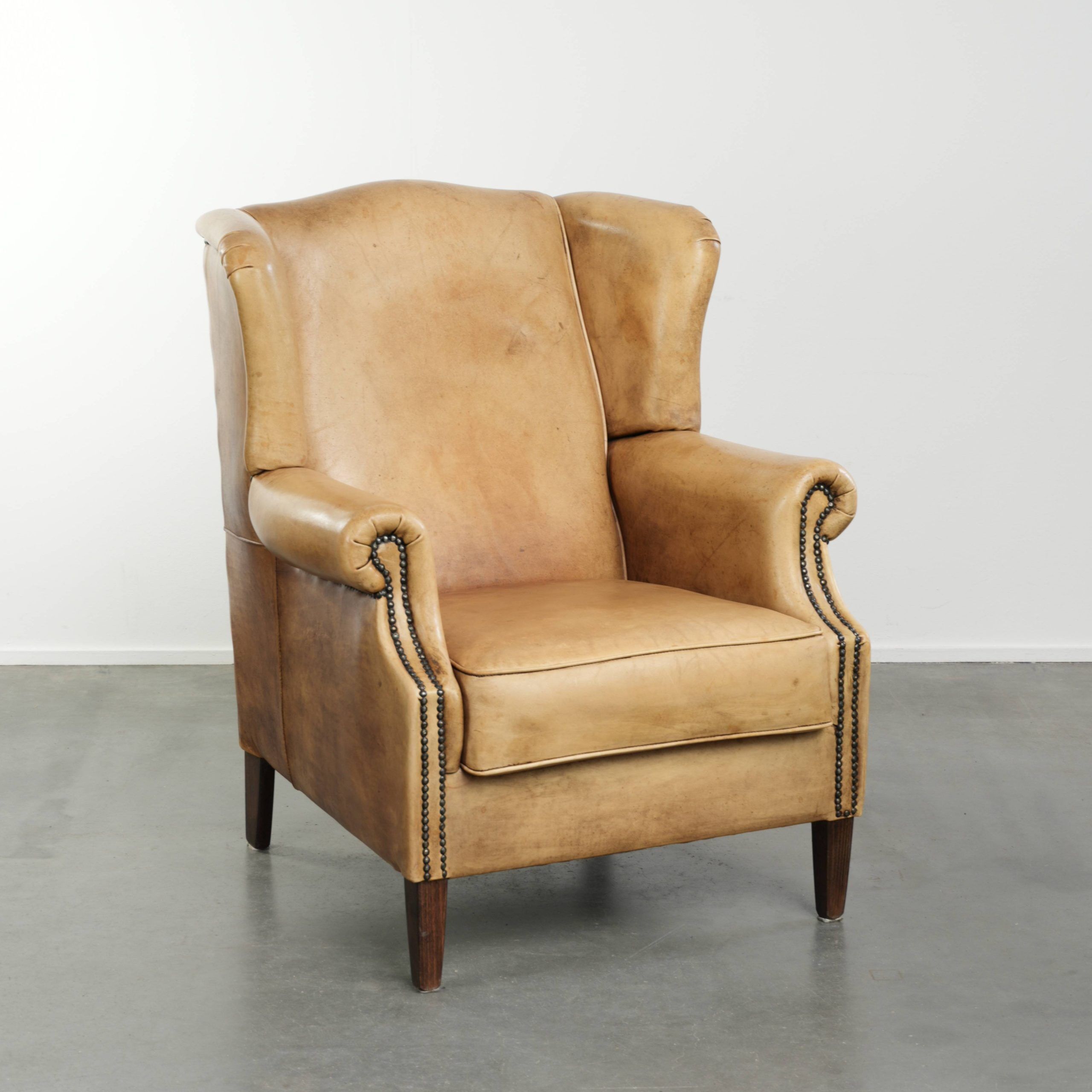 Cow leather wingback armchair with a beautiful timeless English look