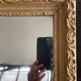 Old small baroque mirror with mercury tin