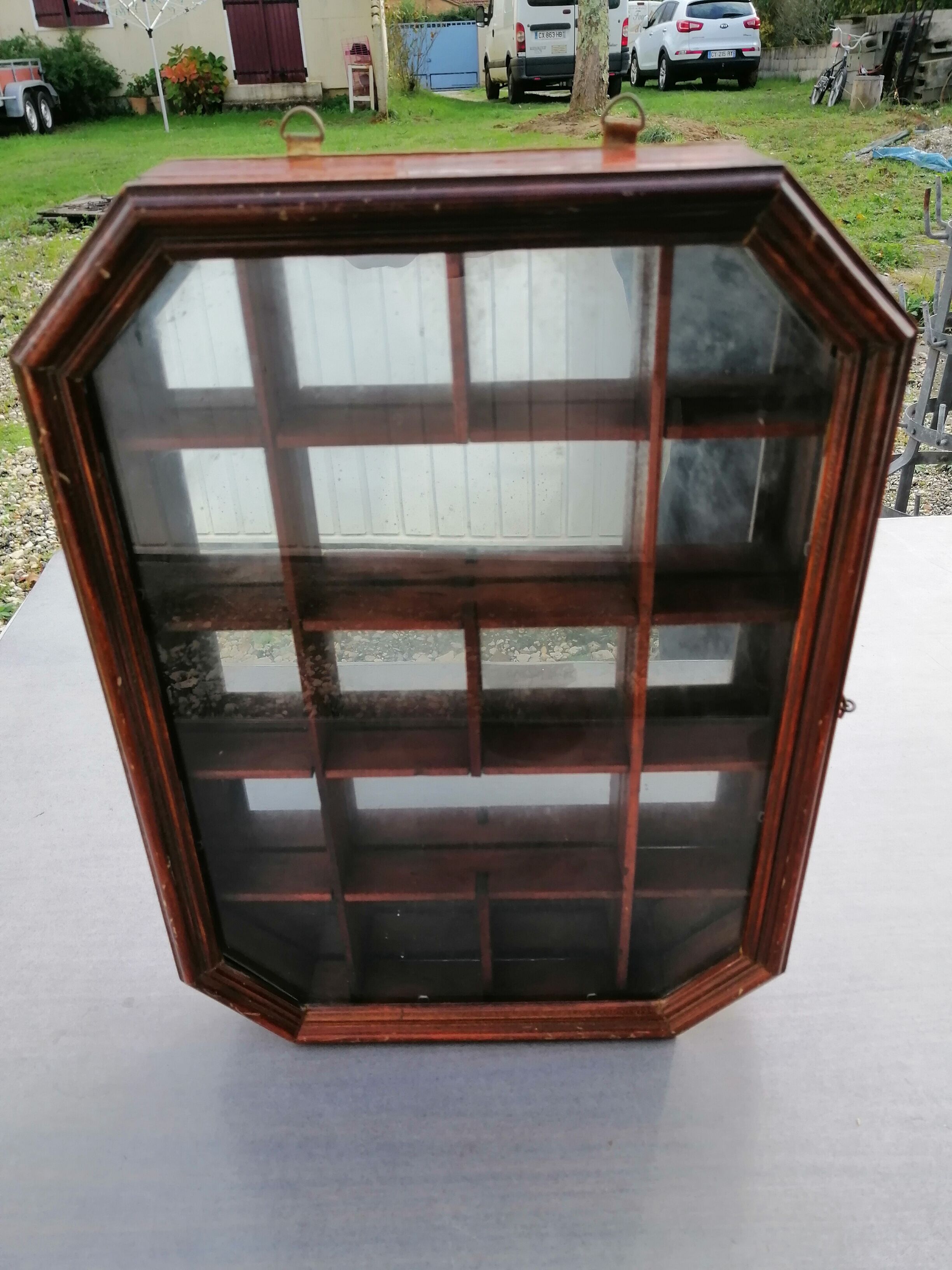 Wall display case for miniature with octagonal compartments
