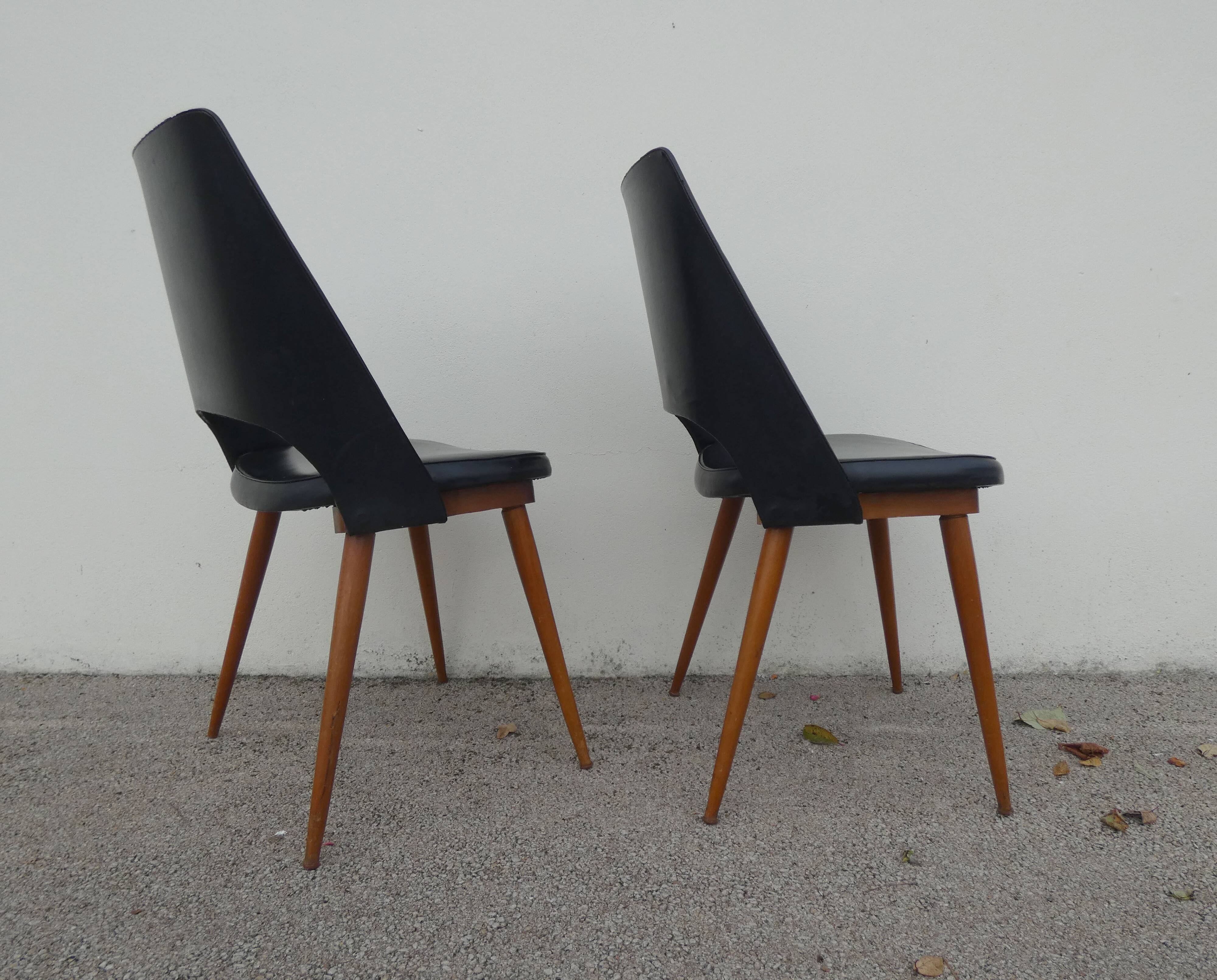 2 chairs in black skai compass legs Louis Paolozzi
