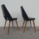 2 chairs in black skai compass legs Louis Paolozzi