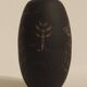 Ceramic vase decorated with women and a tree.