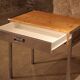 Small dressing table with chrome legs and oak laminate.