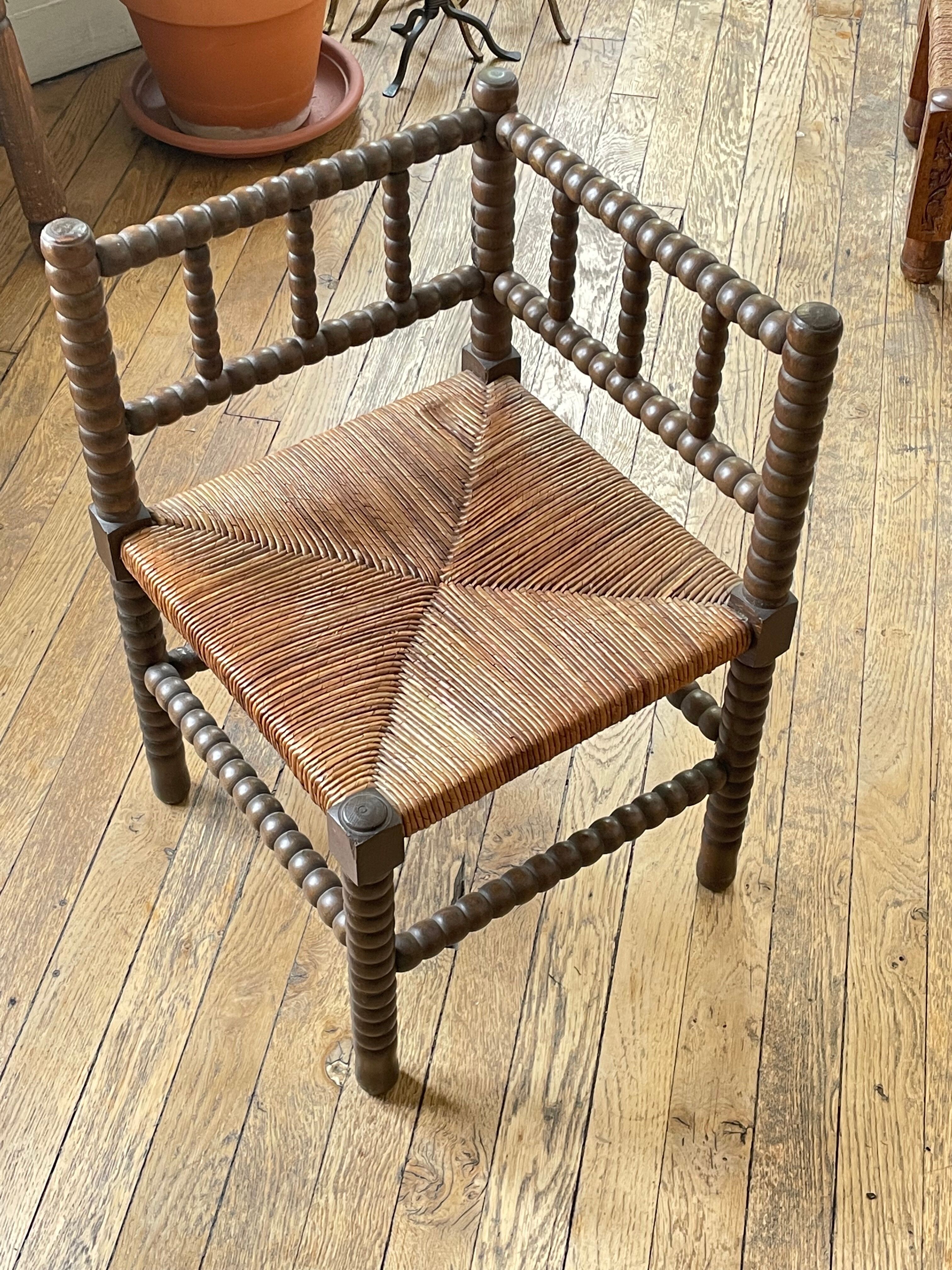Corner chair in vintage beaded wood