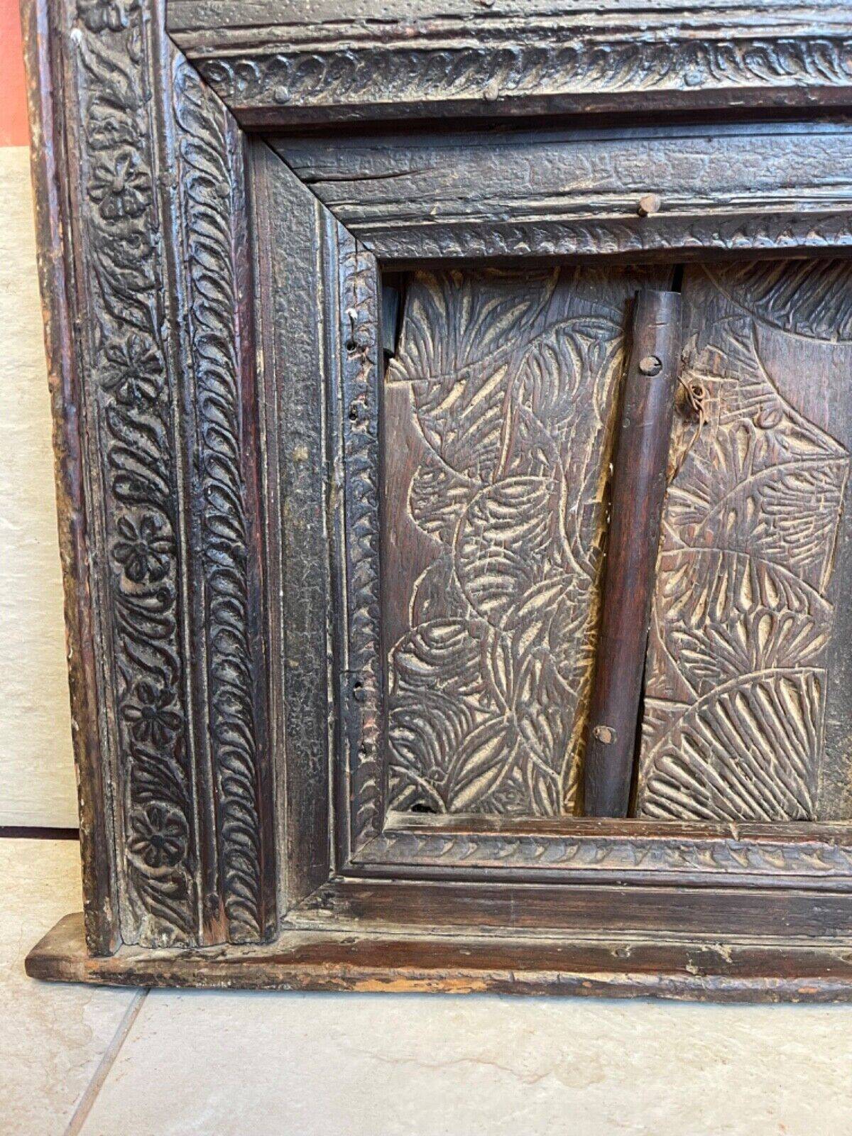 Old Indian window with carved decoration of flowers and foliage 19th century