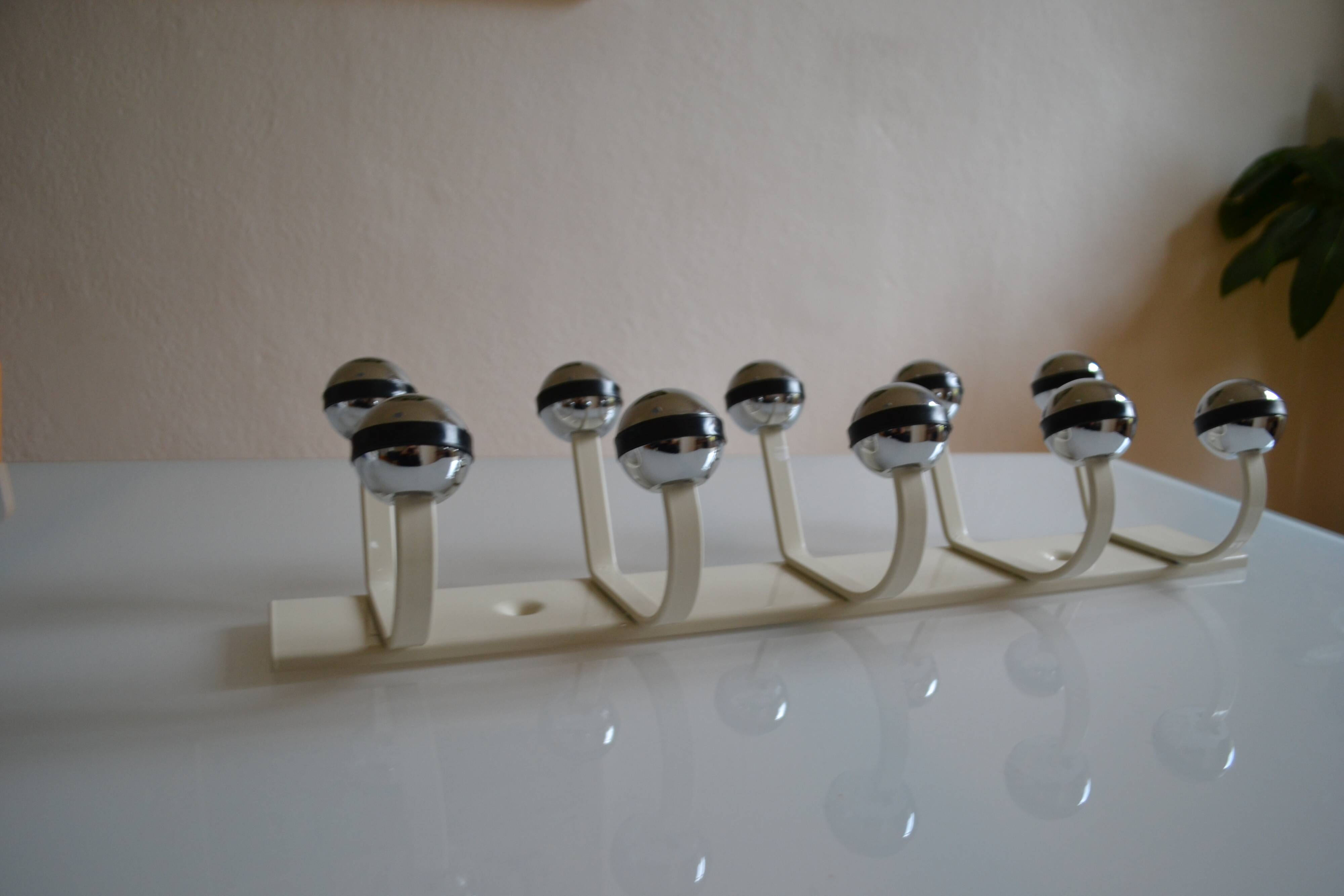 Vintage 1970s wall-mounted coat rack with 10 hooks