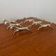 Set of 6 vintage galloping horse knife rests in silver-plated metal.