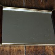 Rectangular mirror tray with wooden handles and gilding.