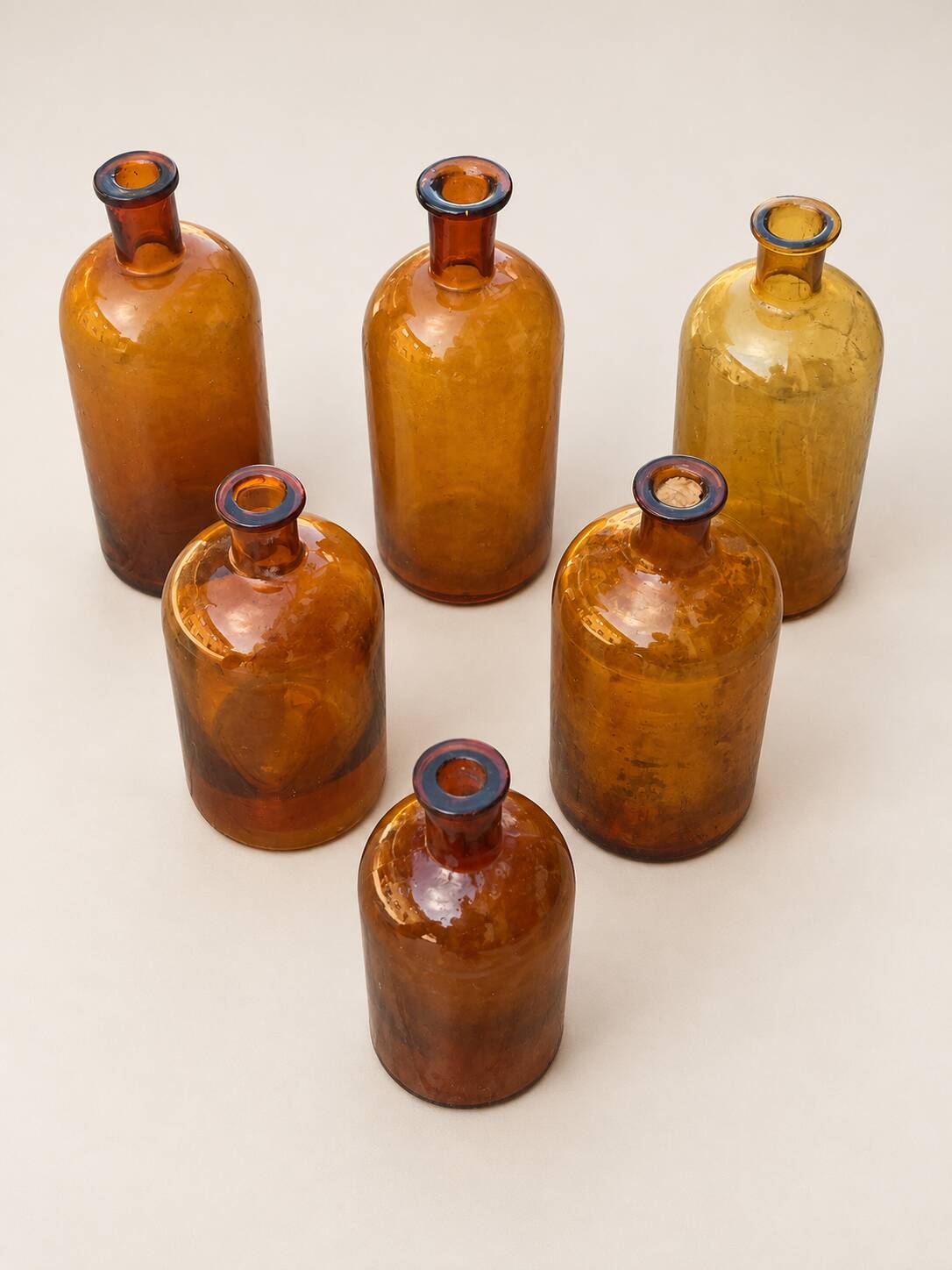 Set of 6 antique amber glass apothecary bottles.