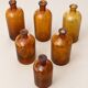 Set of 6 antique amber glass apothecary bottles.