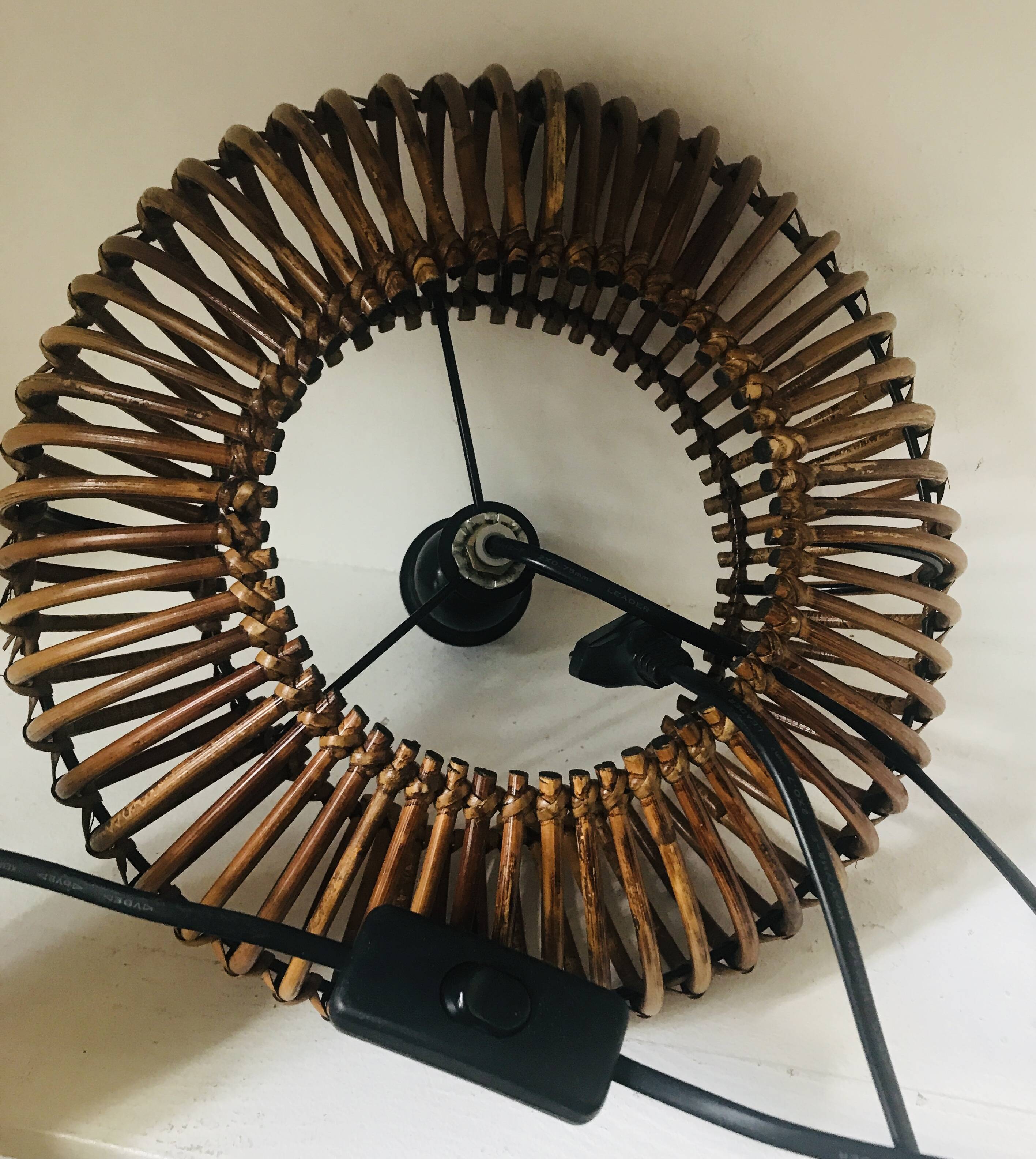 Table lamp with rattan base and papier-mâché hat