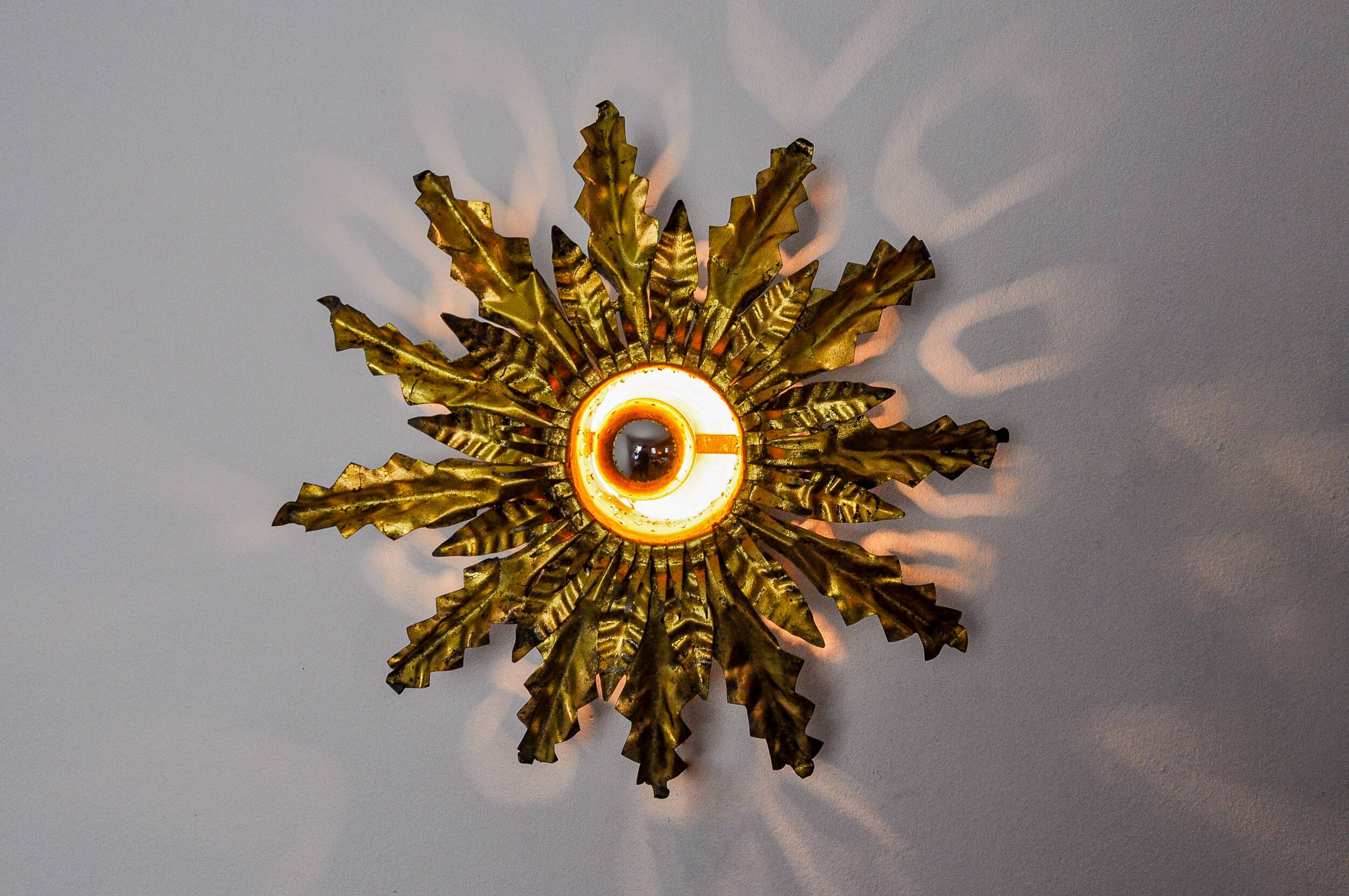 Brutalist sun wall lamp, metal and gold leaf, Italy, 1960