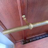 Antique wooden coat rack with mirror and shelf.