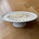 Pie dish on a stand, majolica, apple