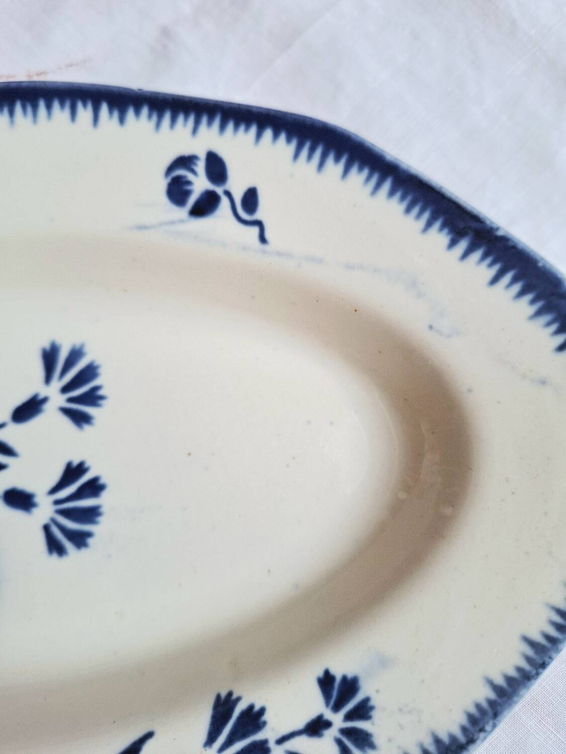 Mismatched antique flat plates accompanied by dishes.