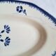 Mismatched antique flat plates accompanied by dishes.