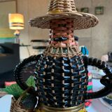 Braided bottle in anthropomorphic wicker