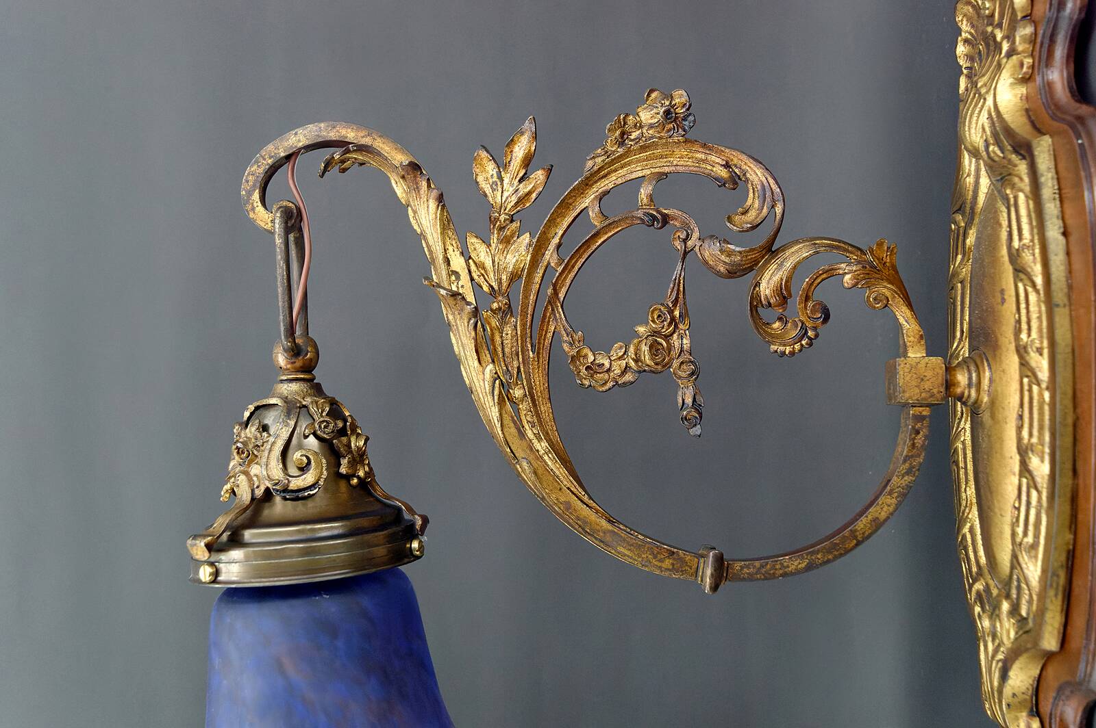 Pair of Rococo / Louis XV wall lights in gilded bronze, walnut bases and glass tulips, France, Circ