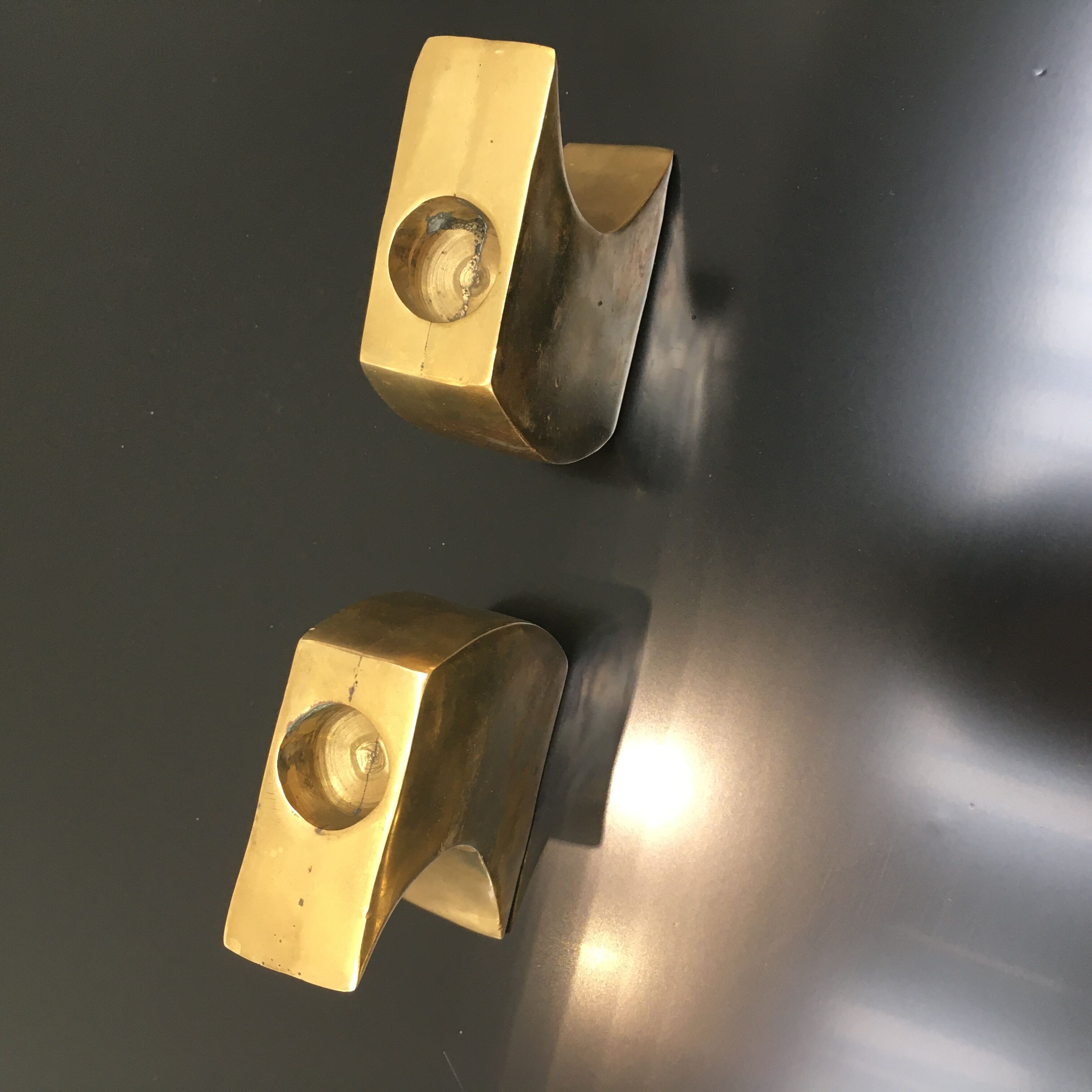 Pair of bronze candle holders by Monique Gerber