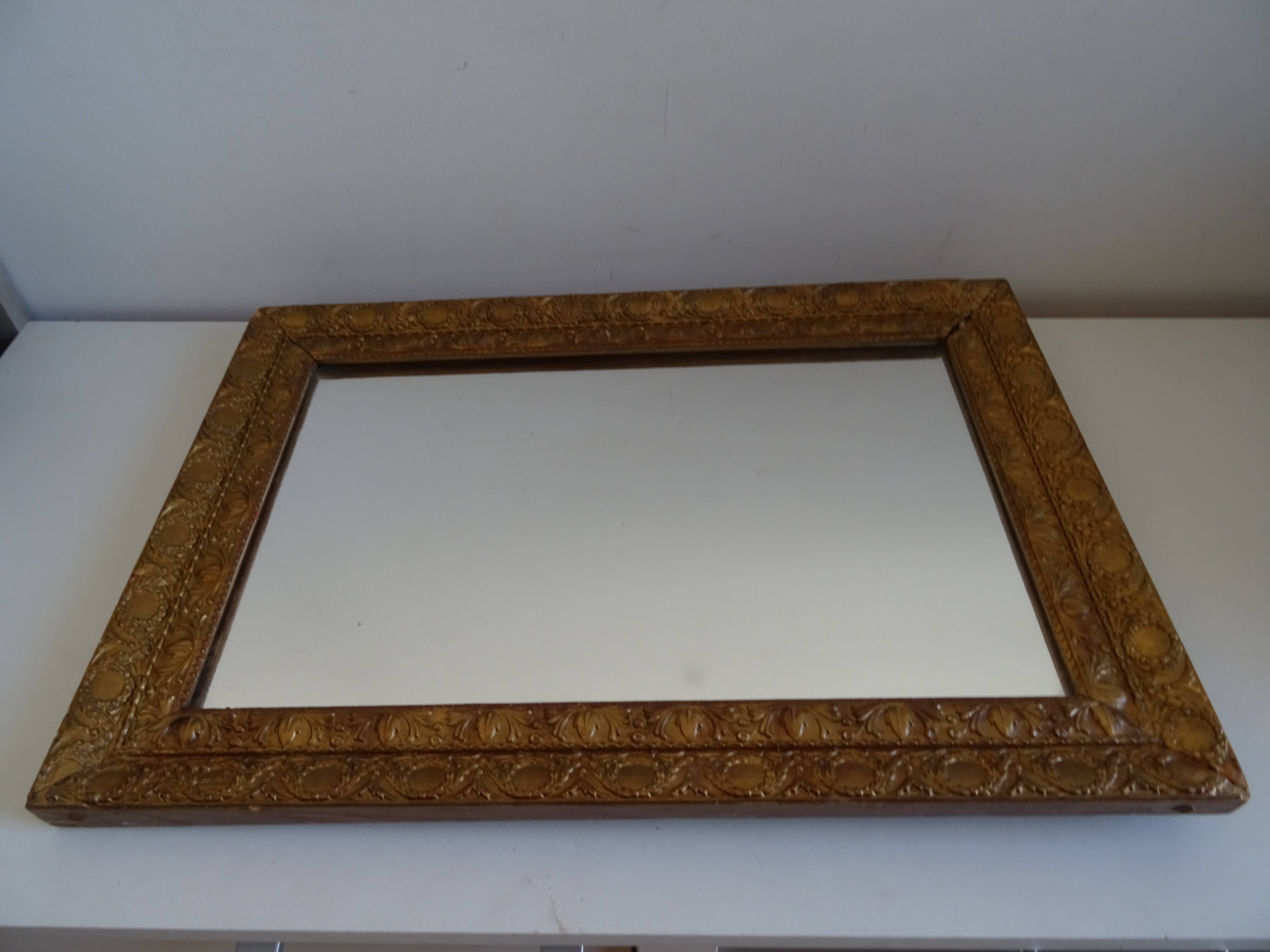 Wood and gilded stucco wall mirror