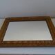 Wood and gilded stucco wall mirror