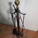 Antique fireplace set in solid wrought iron and brass.