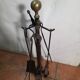 Antique fireplace set in solid wrought iron and brass.