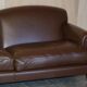 Contemporary Howard & Sons style grand sofa with brass casters.