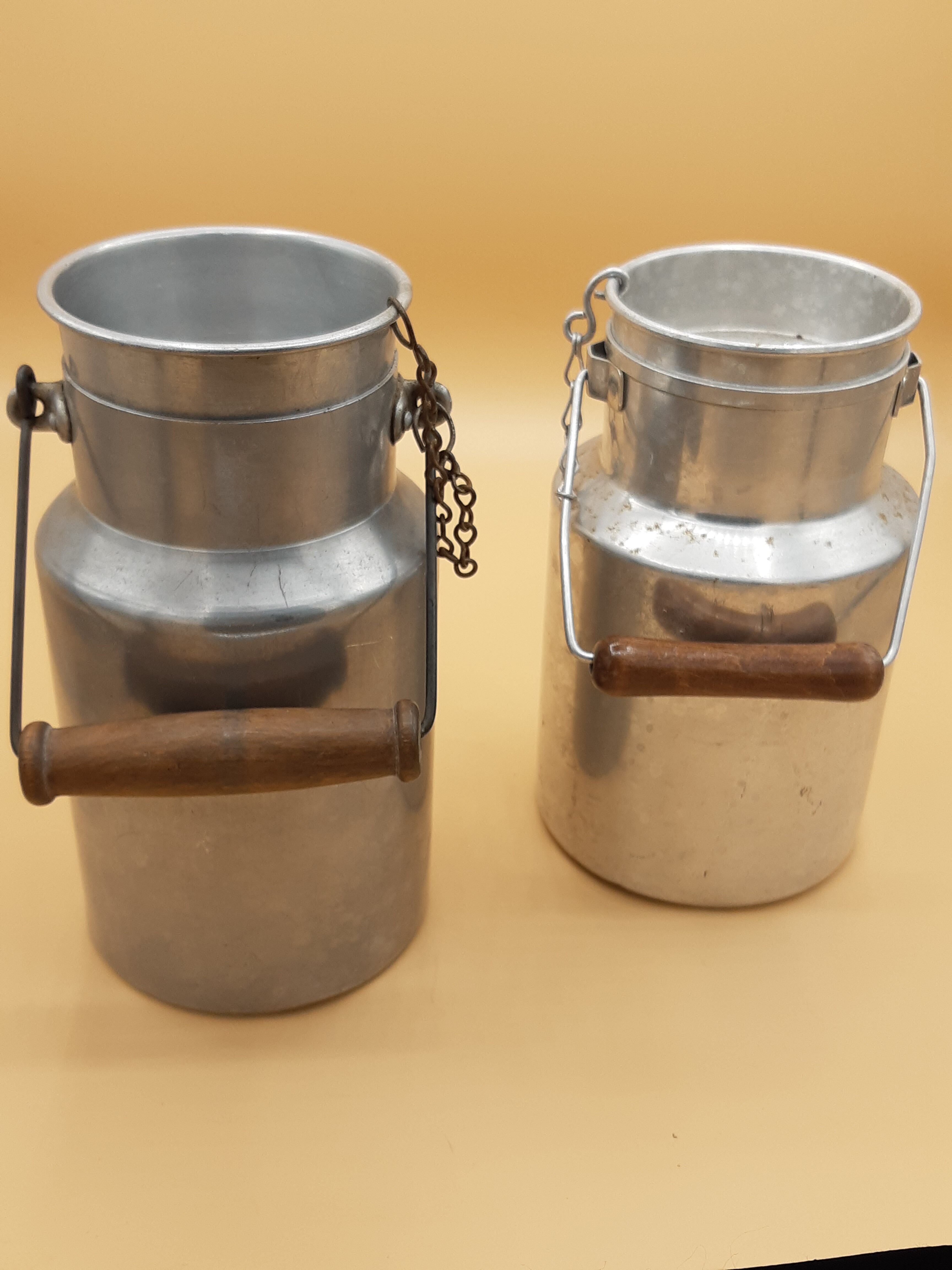 Old aluminum milk jars, wooden handle, lot of 2