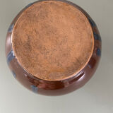 Old blue and brown vase with drips.