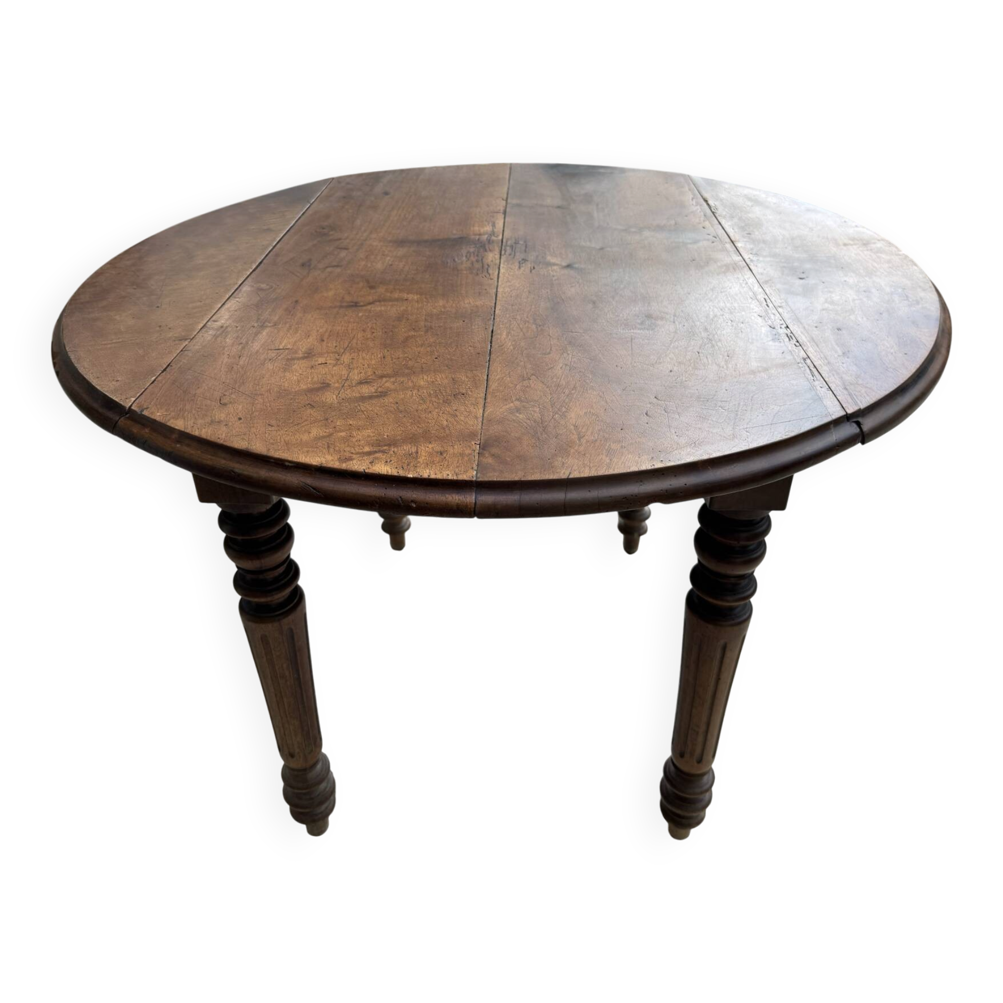 Farm table, two drop-leaves, 19th century, solid walnut.