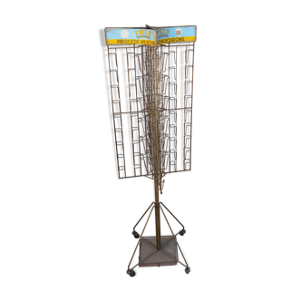 Former turnstile, bearing metal postcards