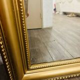 Antique gilded mirror in old Louis Philippe wood